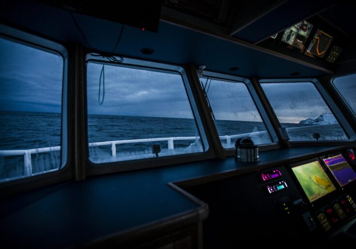Fishing boats out for skrei cod in the arctic sea